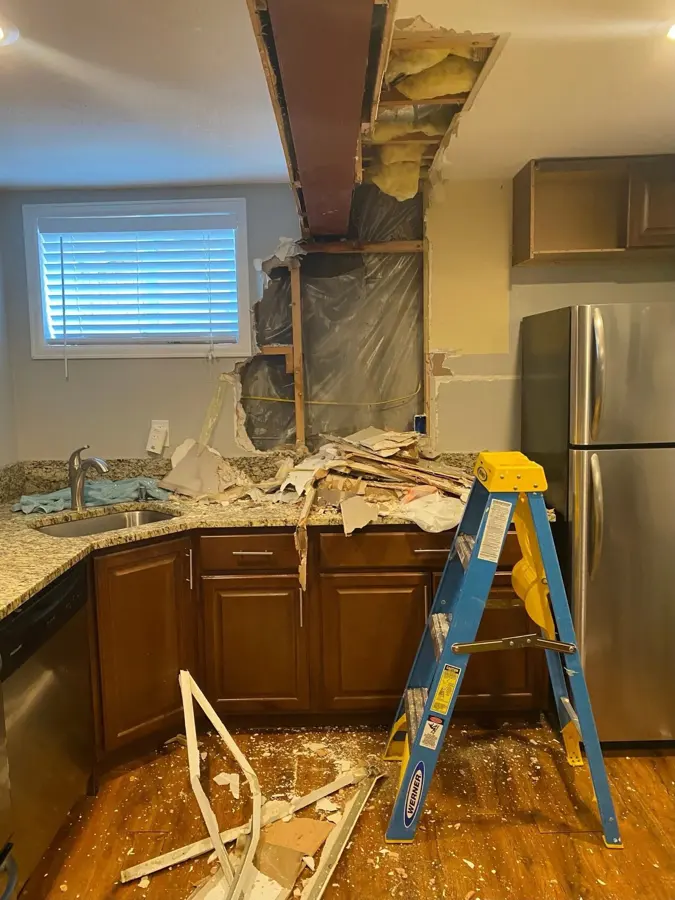 A water-stained kitchen ceiling from an upstairs leak in a Laguna Hills, CA home