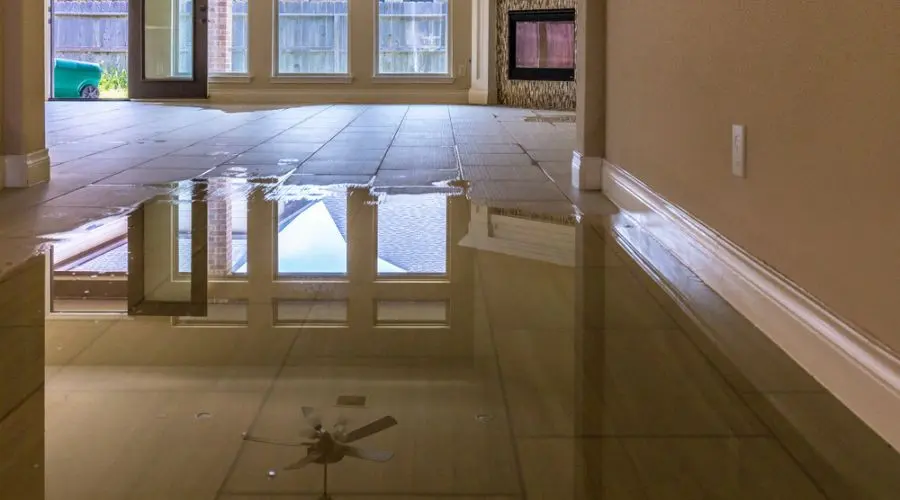 Water spread across a tile floor over a slab in a Laguna Hills, CA home