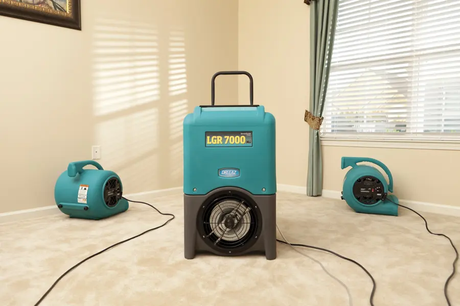 Air movers and a dehumidifier drying a structure in a Laguna Hills, CA home